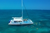 Ariel view of the snorkeling boat with tour participants on the boat and in the water snorkeling with Fury Water Adventure in Key West, Florida.