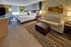 2 Queen beds, sofa bed/seating area, desk and chair at Home2 Suites by Hilton Destin.
