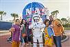 Group poses with an astronaut at Kennedy Space Center