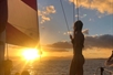 Group enjoying sunset views on a catamaran with Pink Sails Waikiki.