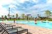 Plenty of lounge chairs in the pool area as well as children's splash pad best for small children