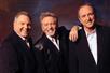 In black suits, The Gatlin Brothers perform in Branson