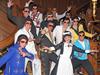 Branson Elvis Festival contestants posing with a crew member on the Titanic Museum’s grand staircase. 