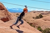 Getting a running start for the zipline on the  Ultimate Zip Line Adventure Moab Utah.