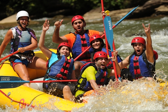 River rafting guide and group going down the Ocoee River in Tennessee.