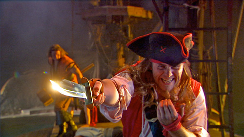 A pirate lunges his sword forward